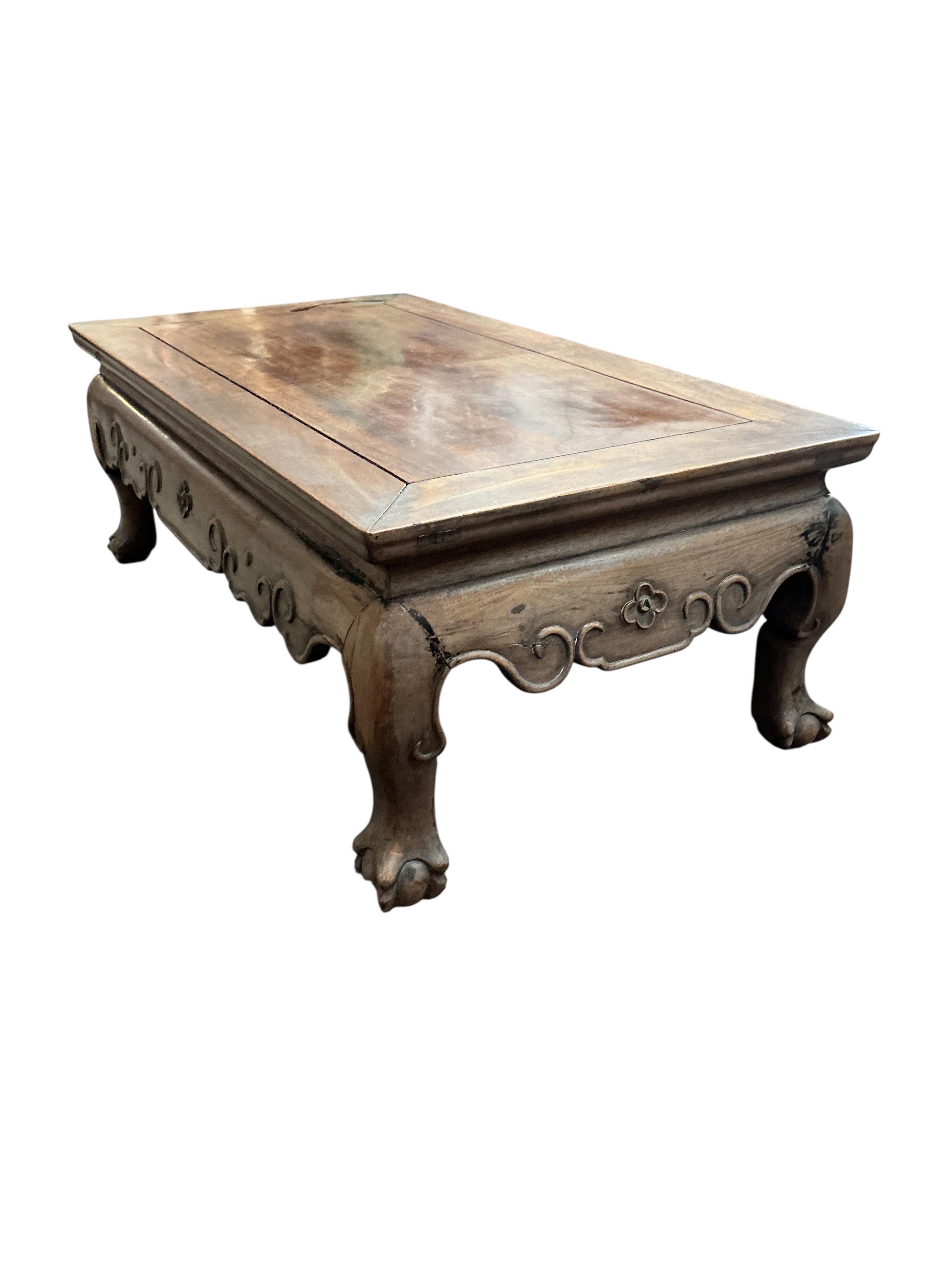 A Chinese rectangular hongmu low table, faded, width 77cm, depth 42cm, height 28cm